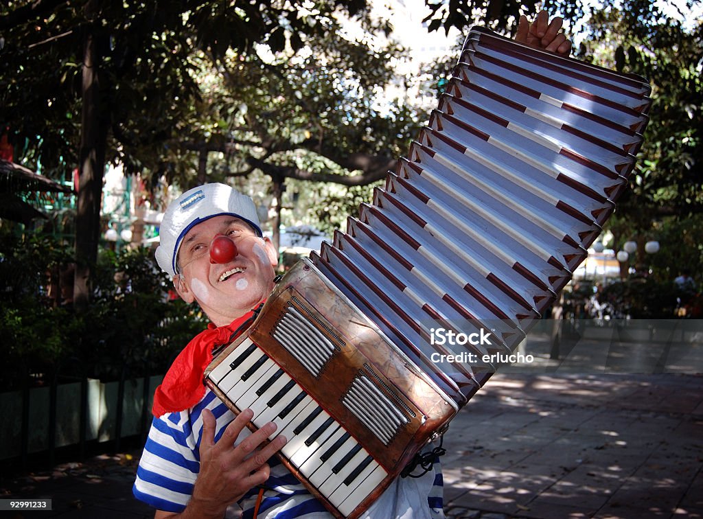 Street Artist Accordionist Clown on the Buenos Aires Streets. Clown Stock Photo