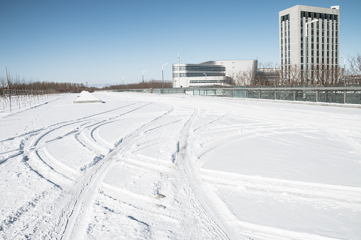 Car tire track in snow