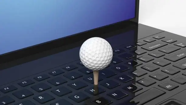 Photo of Golf ball on laptop keyboard