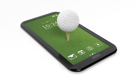 Golf ball on green tablet screen,isolated on white background