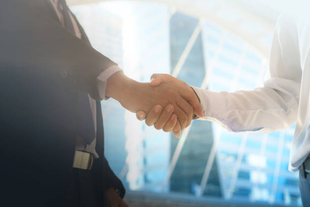 istock Closeup of Business people shaking hands 929922482
