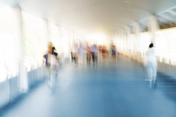 istock People walking in motion blur in the city 929922494