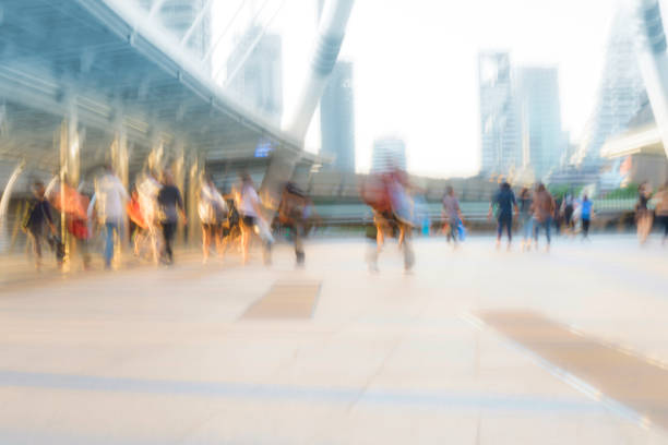 istock People walking in motion blur in the city 929922538