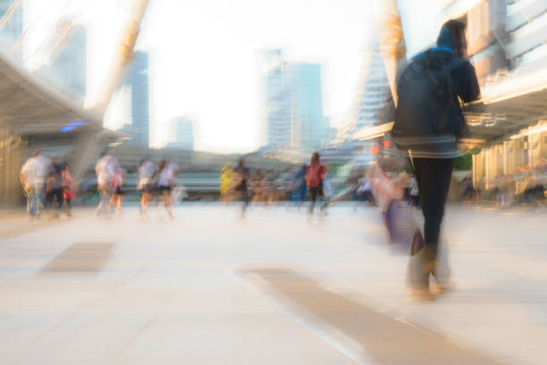 istock People walking in motion blur in the city 929922554