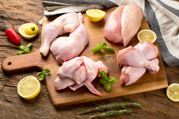 Raw uncooked chicken meat on wooden board. Raw uncooked chicken meat on wooden board. Healthy eating drumstick stock pictures, royalty-free photos & images