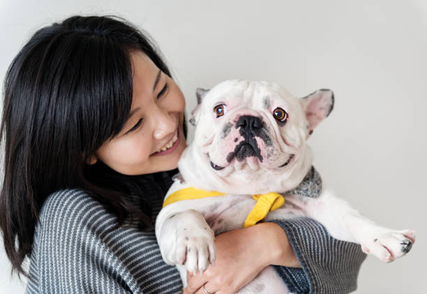 istock Asian woman hugging dog 929929844