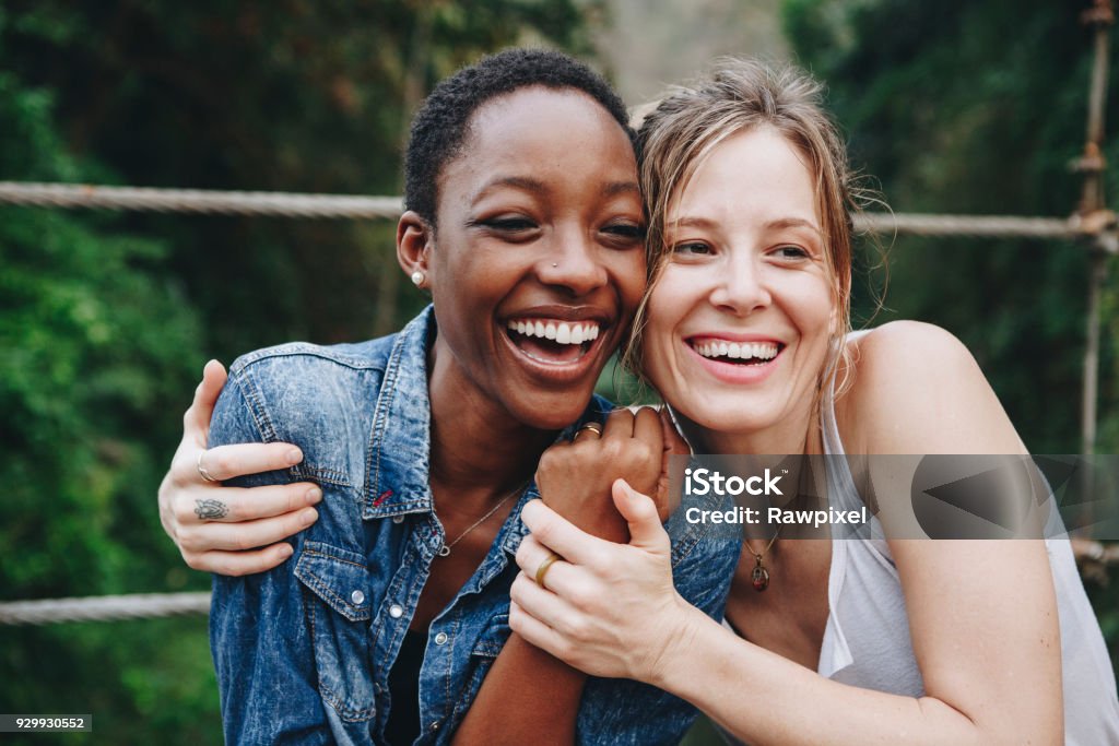 Happy women hugging each other Friendship Stock Photo