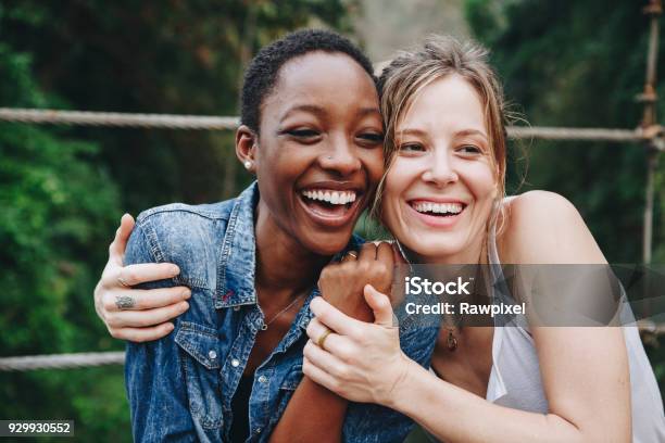 Happy Women Hugging Each Other Stock Photo - Download Image Now - Friendship, Women, Embracing