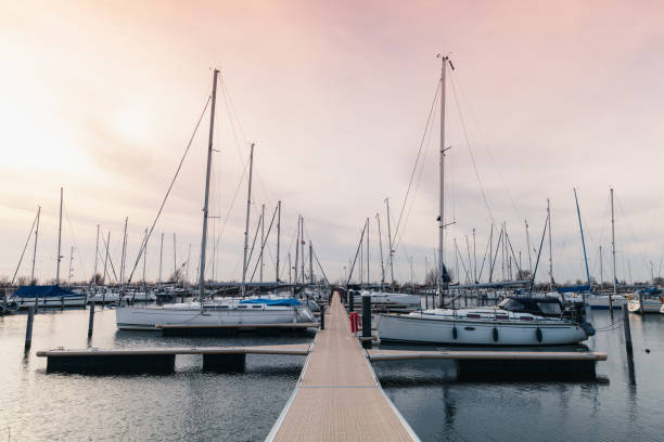 istock Floating pier with moored sailing yachts 929936236