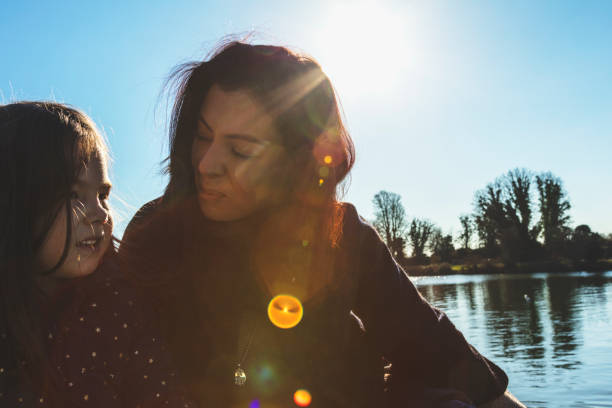 Mother with her daughter in the park, family time, London, England