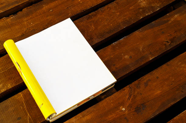 Image of a person looking at a photobook on the table