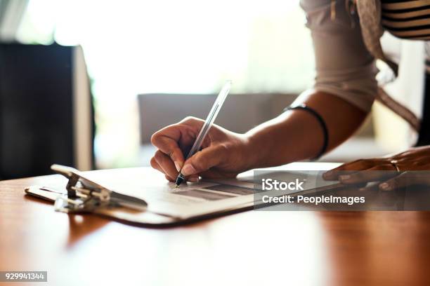 Filling Out An Important Form Stock Photo - Download Image Now - Clipboard, One Person, People