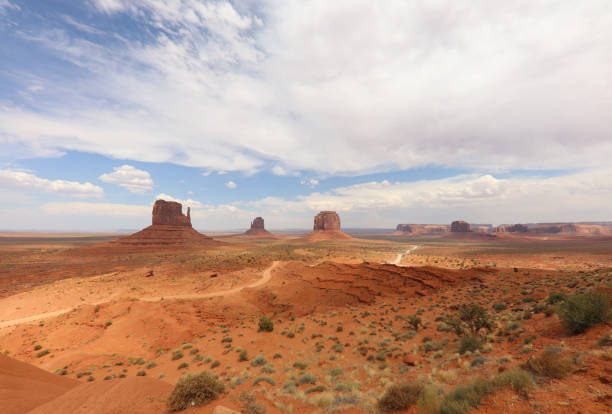 Panorama with West Mitten Butte, East Mitten Butte and Merrick Butte in Monument Valley. Arizona. USA Panorama with West Mitten Butte, East Mitten Butte and Merrick Butte in Monument Valley. Arizona. USA west mitten stock pictures, royalty-free photos & images