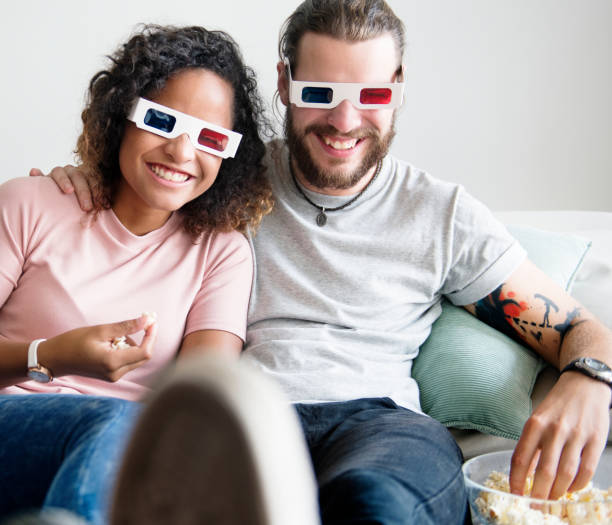 istock Couple watching 3D movie together 929948360