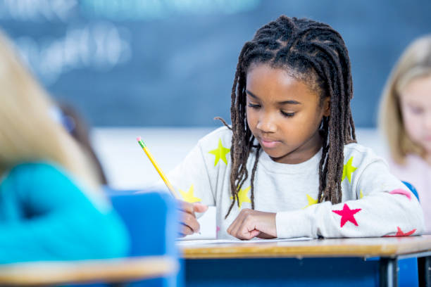 istock Girl Concentrating At School 929949160