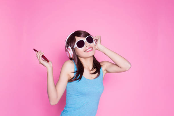 istock woman use phone listen music 929949610
