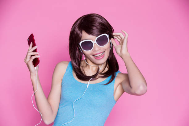 istock woman use phone listen music 929949848