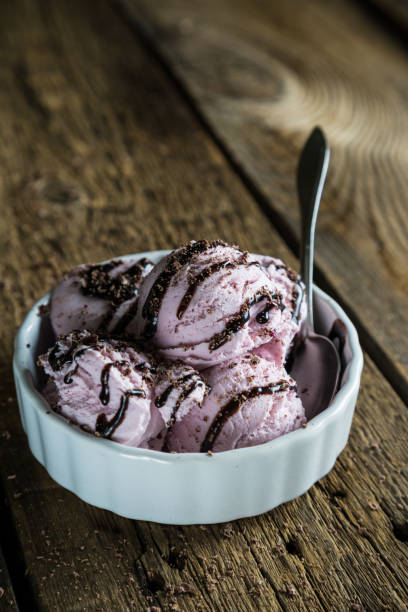 istock Balls of berry ice cream on a wooden table 929951954