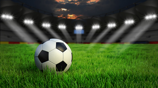 Ball on gras in soccer stadium with illumination at night, 3D rendering