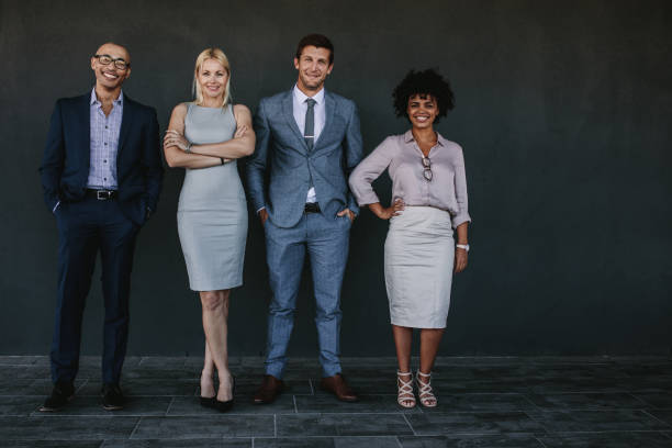 istock Successful business team standing together and smiling 929953228