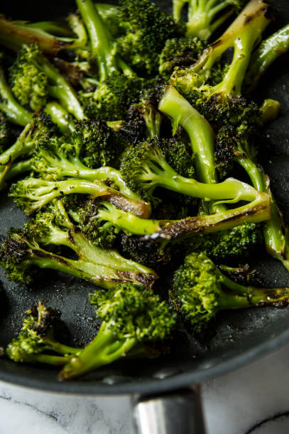 istock Grilled broccoli roses in a frying pan. 929955826
