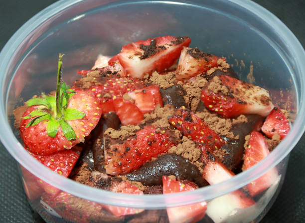 istock Home made cake and chocolate lava, topping by Strawberries cut into pieces with cocoa powder. 929956800