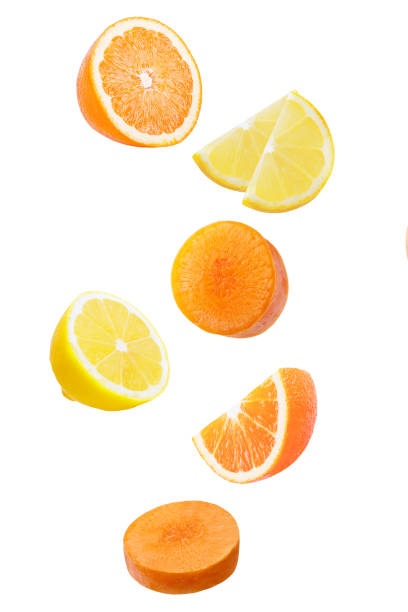 istock Falling orange, limon and carrot isolated white 929957266