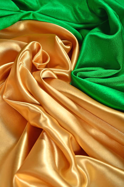 istock Natural golden and green satin fabric texture 929961180