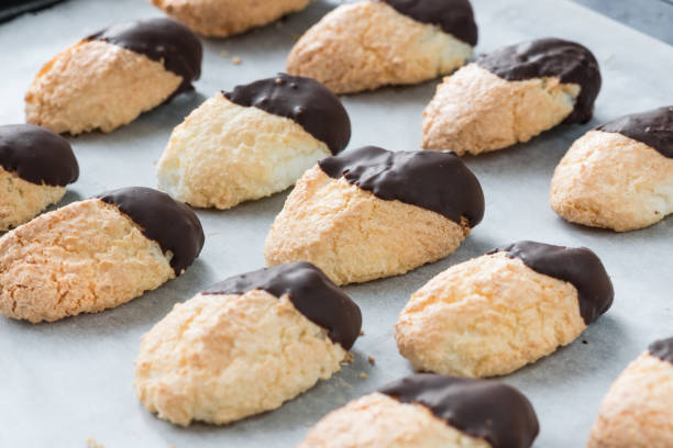 Homemade coconut and chocolate cookies on baking paper
