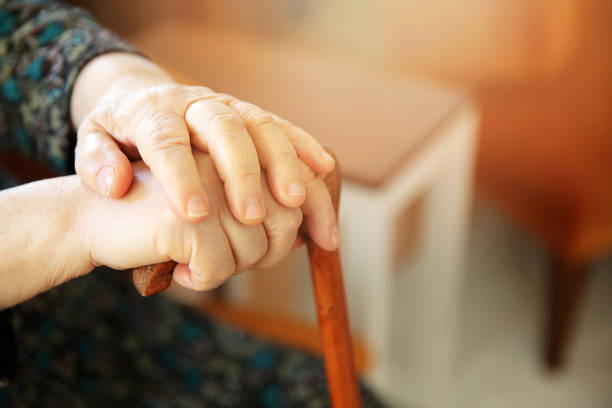 istock Old woman with cane 929968854