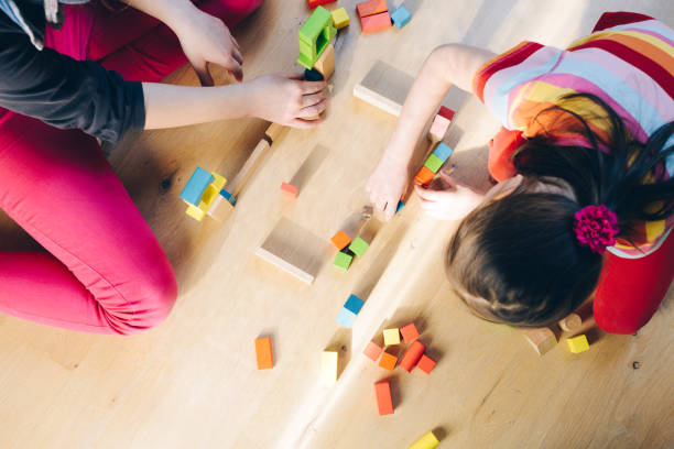 istock children playing with colorful wooden blocks 929972174