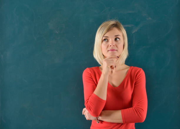 istock Woman portrait on blackboard. Copy Space. 929976850