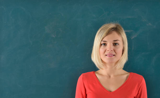 istock Woman portrait on blackboard. Copy Space. 929976906