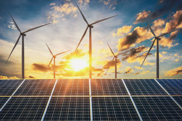 istock wind turbine with solar panels and sunset. concept clean energy 929981724