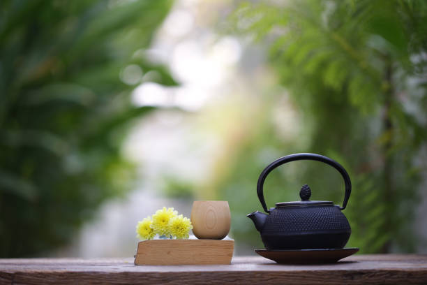 istock Black vintage teapot and cup with diary at outdoor 929986512