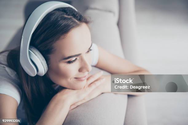 Chillout Satisfaction Therapy Wellness Leisure Lifestyle Mode Charmed Adorable Brown Haired Adorable Model Enjoying To The Stereo Sound In Big Modern Ear Phones In A Room Nice Break Goodday Stock Photo - Download Image Now
