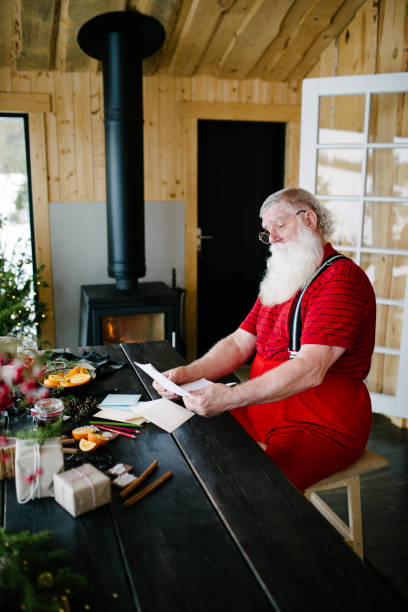 istock Santa Claus reading children's letters 929997146