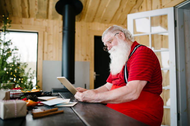 istock Santa Claus and digital tablet 929997276