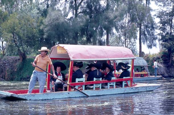 A Mariachi band goes by boat through the canals of Xochimilco.