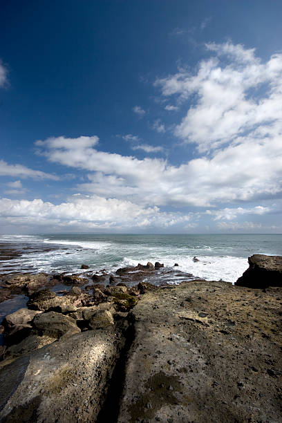 istock ocean waves crashing against a rocky shore 93000266