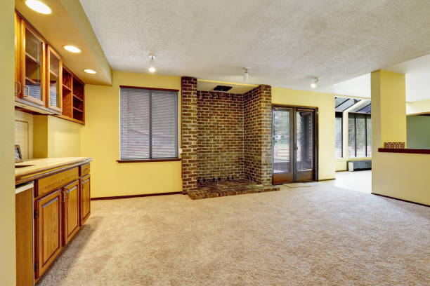 istock Empty family room interior with soft yellow walls 930007562