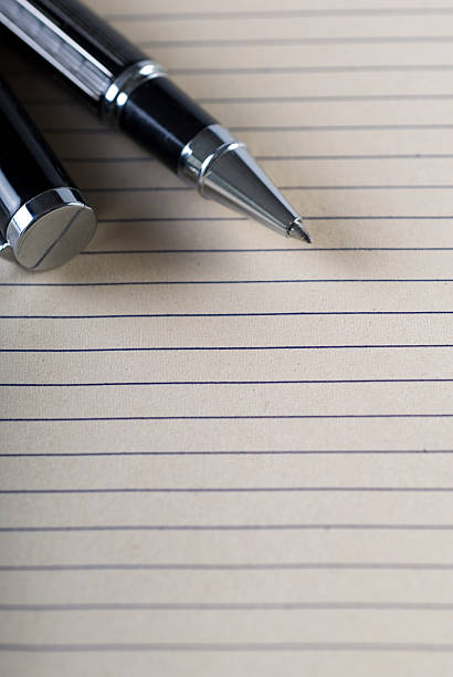 Closed picture of a person writing on a blank page