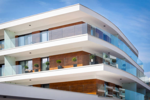 istock Modern architecture with rows of balconies in modern white apartment building 930011572