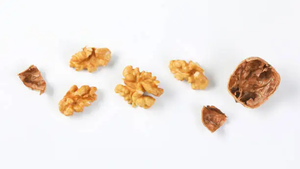 Photo of walnut kernels and shells