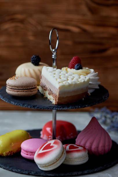 istock Cakes on a dark slate bunk stand.Desserts. Sweet table 930026800