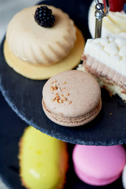 istock Cakes on a dark slate bunk stand.Desserts. Sweet table 930026912