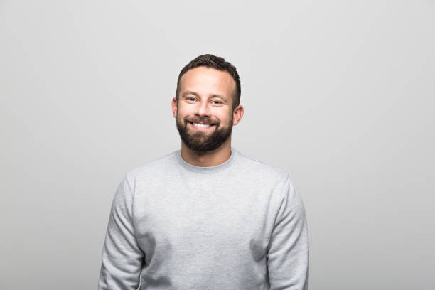istock Portrait of cheerful bearded young man, grey background 930030456