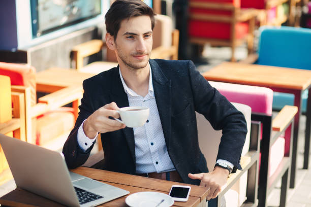istock Young handsome man enjoy coffee working on laptop 930030518