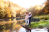istock Senior couple on a walk in autumn nature. 930031030