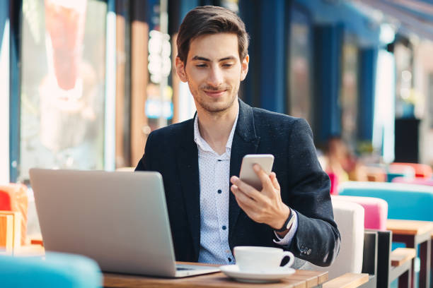 istock Man looking to phone and touching the screen 930031046